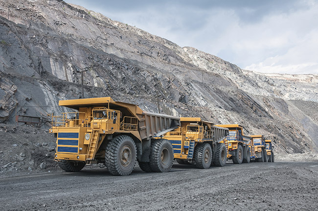ore trucks at an open cut mine